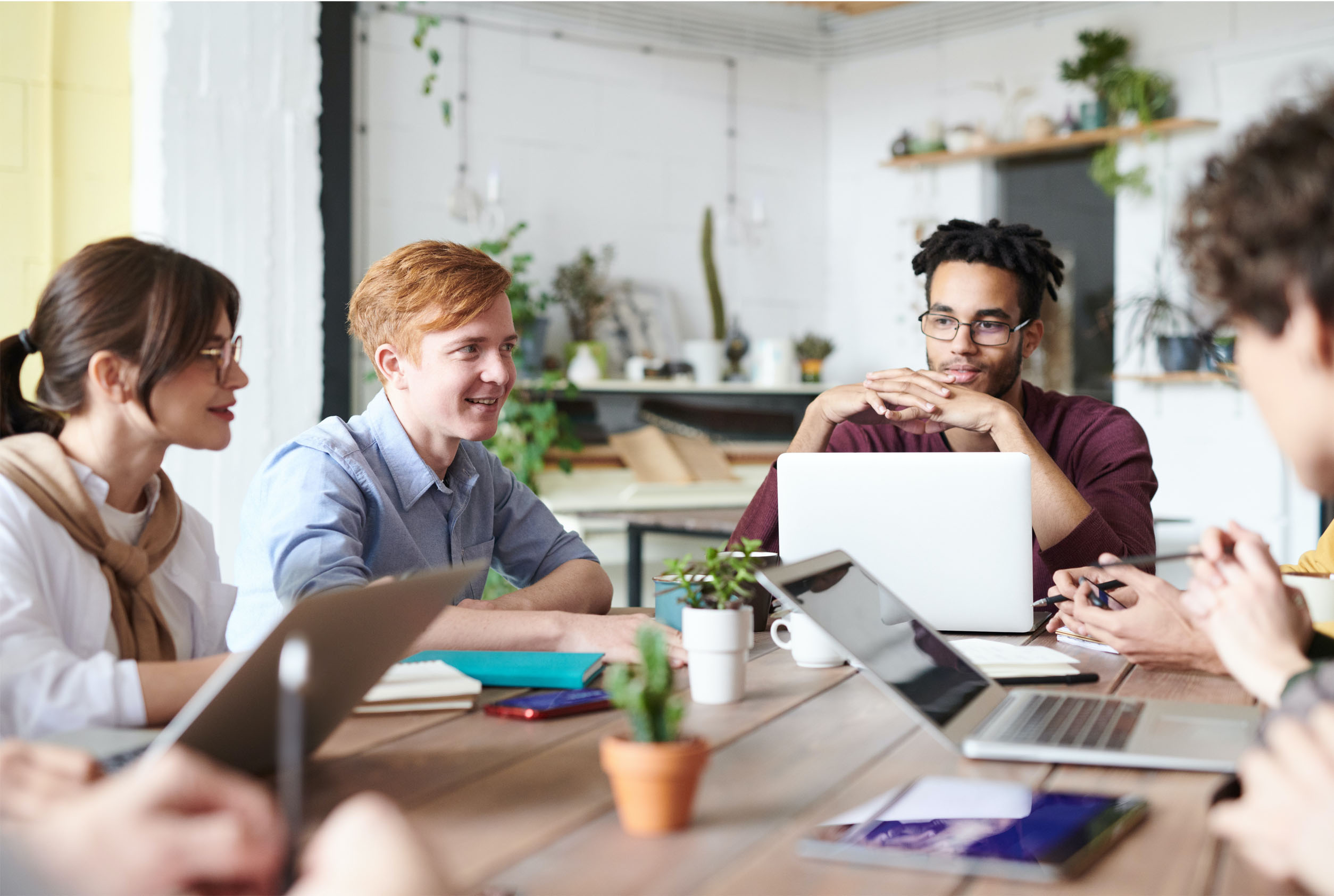 Group of office workers using laptops