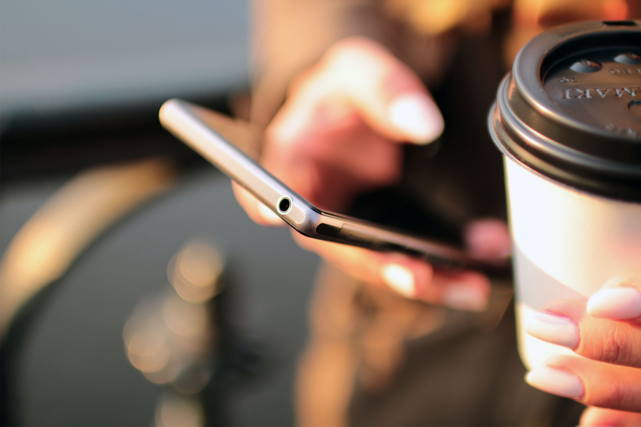 cellphone and coffee cup