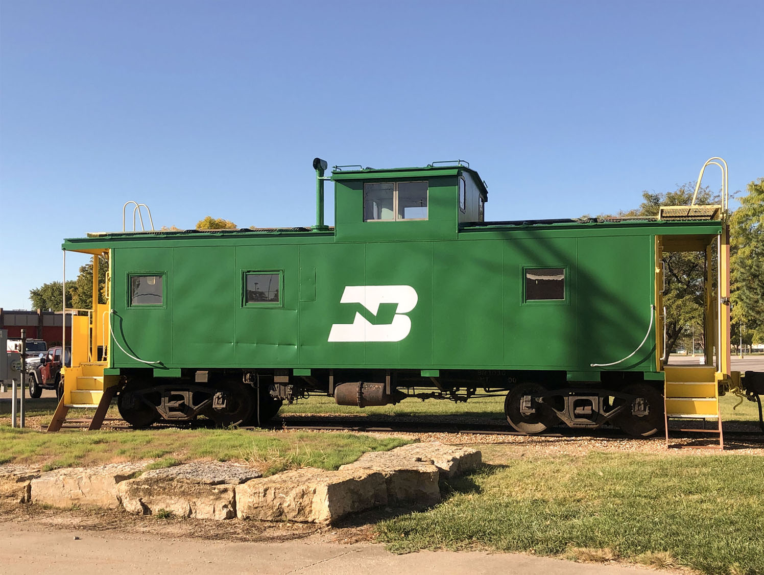 Green and yellow train car